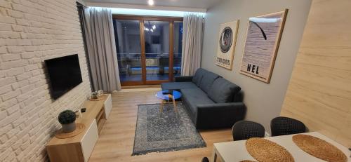 Μια τηλεόραση ή/και κέντρο ψυχαγωγίας στο Apartament Jurata Deluxe