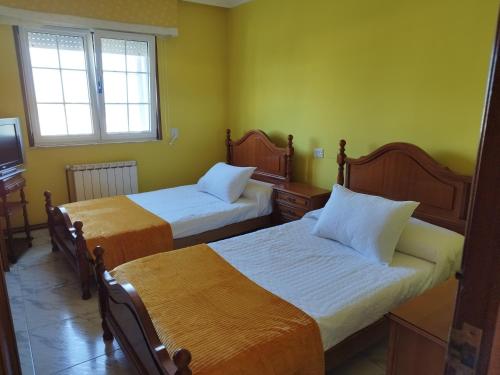 Ένα ή περισσότερα κρεβάτια σε δωμάτιο στο Casa Fina