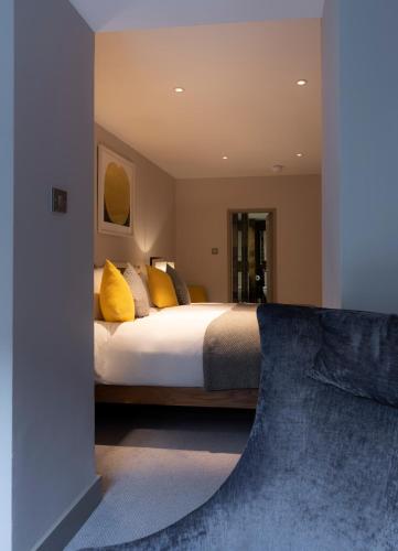 a bedroom with a large bed with yellow pillows at Number 31 in Dublin