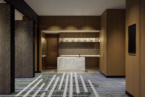 a lobby with a table in the middle of a room at Sheraton Kagoshima in Kagoshima