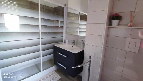 a bathroom with a sink and a mirror at Casa Sara in Gaeta