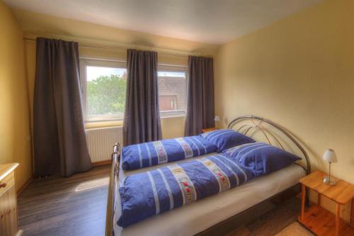Postel nebo postele na pokoji v ubytování Elbblick-Ferienwohnung