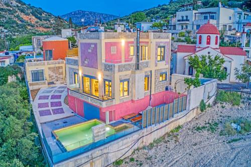 an aerial view of a house with a pool at Anemomili Villas in Drapaniás