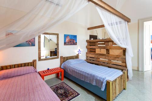 A bed or beds in a room at Casa vacanza Enea con idromassaggio - Apulia Home