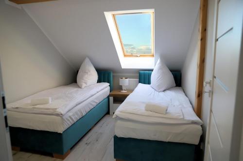 Ένα ή περισσότερα κρεβάτια σε δωμάτιο στο Apartamenty Jawor