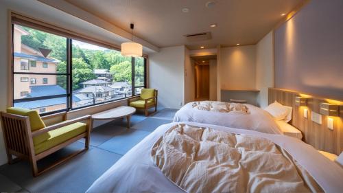 Voodi või voodid majutusasutuse Nakamatsuya Ryokan toas