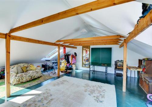 a living room with a couch and a table at The Stables in Whitland