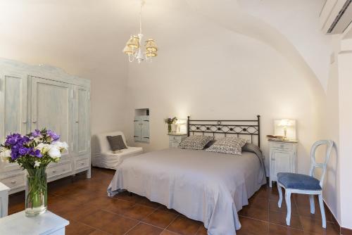 Postel nebo postele na pokoji v ubytování B&B I Tre Camini