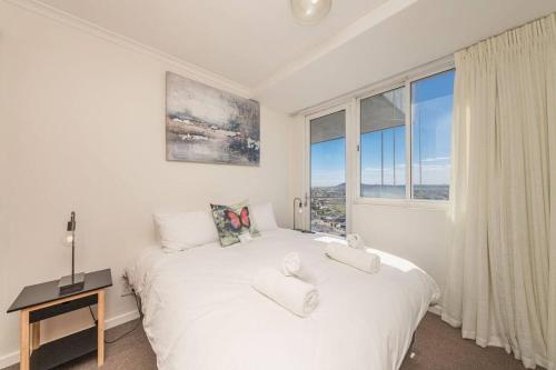 Ένα ή περισσότερα κρεβάτια σε δωμάτιο στο Horizon Bay 1505 by HMH