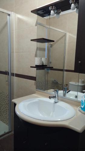 a bathroom with a sink and a mirror at Casa Albelo do Gerês in Montalegre