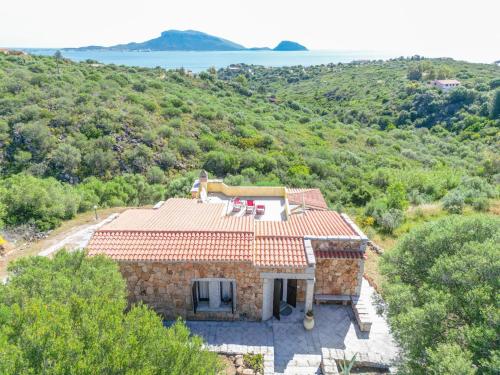 an external view of a stone house with a view at Holiday Home Pietra by Interhome in Pittulongu
