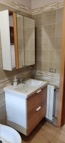 a bathroom with a sink and a mirror at La Giara Bed&Breakfast in Brienza