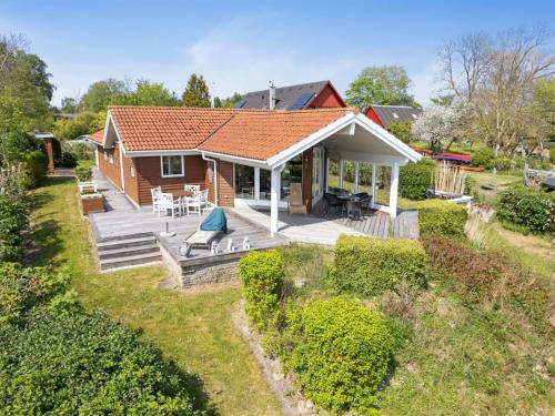 an aerial view of a house with a deck at Holiday Home Brunman - 10m to the inlet in Sealand by Interhome in Grevinge