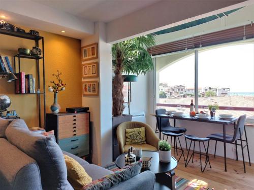 a living room with a couch and a table at Apartment Zirlinga-9 by Interhome in Bidart