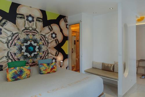 a bedroom with a large painting on the wall at Lisbon Art Stay Apartments Baixa in Lisbon