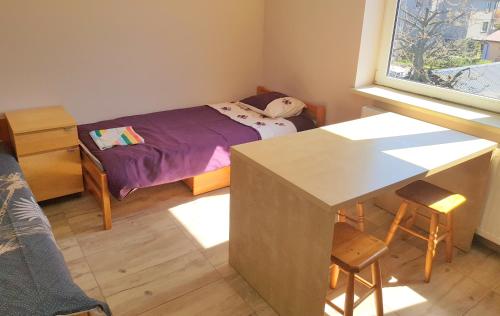 Ein Bett oder Betten in einem Zimmer der Unterkunft Hostel Pruszcz Gdański