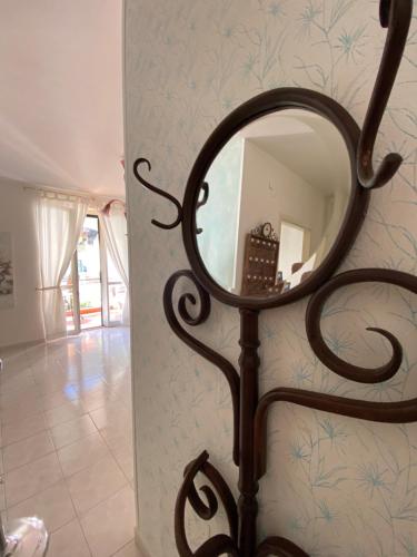 a mirror on a stand next to a wall at Gogas Amalfi Coast in Cetara