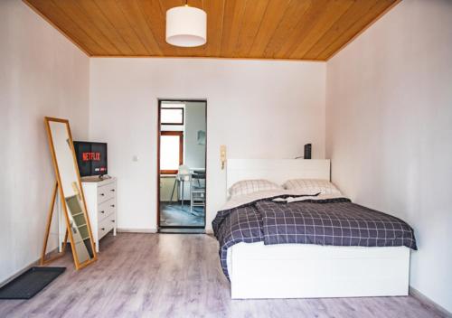 Postel nebo postele na pokoji v ubytování Moderne Wohnung in Neuwied City - fußläufig zum Rhein