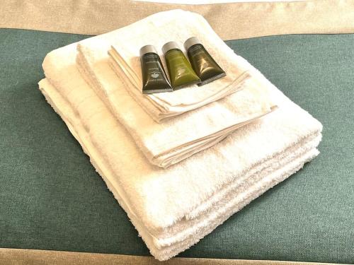 two towels sitting on top of a table at The Woodlands in Horley