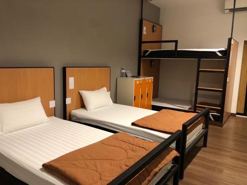 Postel nebo postele na pokoji v ubytování Thyme Xeriscape Hostel