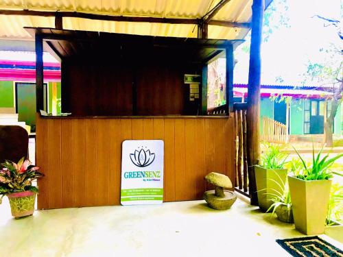 a restaurant with a sign on the side of a building at GreenSenz Resort & Hostel-Sigiriya in Sigiriya