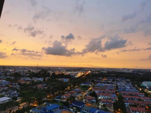 an aerial view of a city at sunset at Stylish Micasa 4 Home 3BR+FREE PARKING -Hann's Residence in Sibu