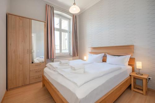 Postel nebo postele na pokoji v ubytování Villa Vineta Wohnung 203