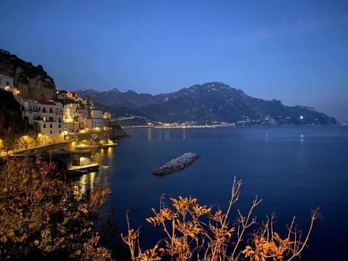 a view of a body of water at night at FRENNESIA Amalfi Coast in Atrani