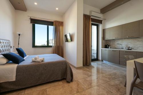 a bedroom with a bed with a teddy bear on it at Bed&Belvedere in Otranto