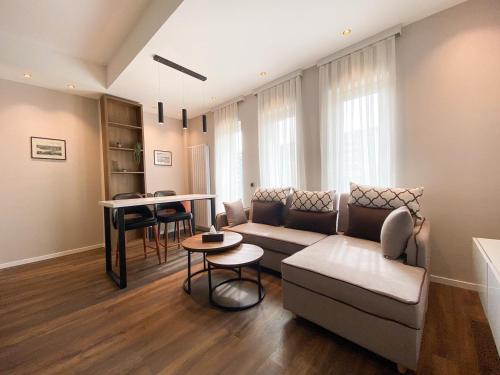 a living room with a couch and a table at Golden Horn Apart Hotel in Baku
