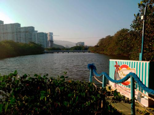 a view of a river with buildings in the background at Playa del Ritmo Beach Hostel & Bar - Adults Only in Santa Marta
