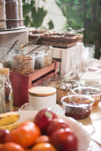 a table topped with tomatoes and other food items at Santner, Hotel in Eugendorf