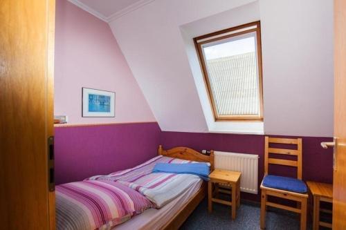 Postel nebo postele na pokoji v ubytování Appartement in Pellworm mit Grill, Terrasse und Garten