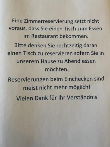 a white sign with the words twitch istg istg istg istg istg istg istg istg istg at Parkhotel Krone in Emmendingen