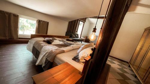 a bedroom with a bed and a mirror at Casa Ana new in 2025 high speed Starlink wifi in Buzet