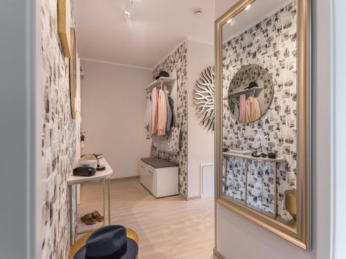 a dressing room with a mirror and a dressing table at Villa Baltic Zingst - AP Strandfein in Zingst