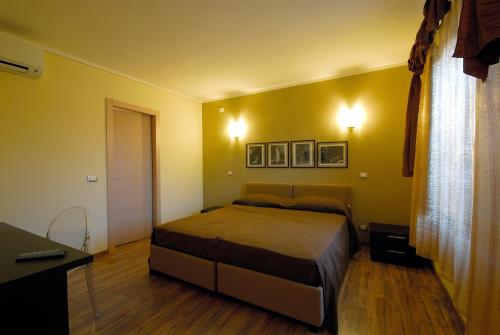 Кровать или кровати в номере Affittacamere Il Persicone