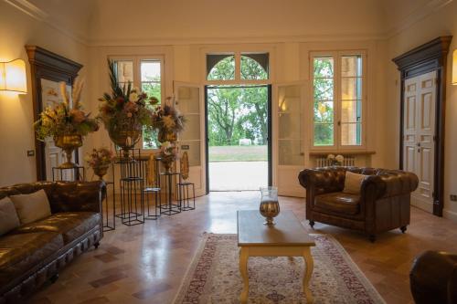 a living room with two couches and a table at Villa Nena in Tolentino