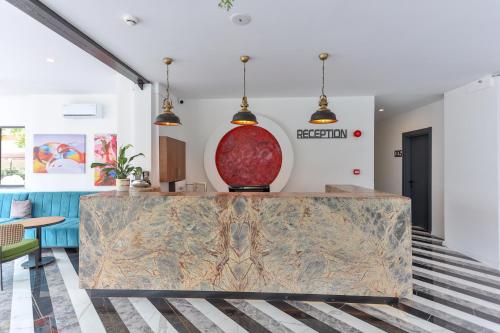 a lobby with a marble counter top in a room at Wolf Of The City Hotel & Spa in Antalya