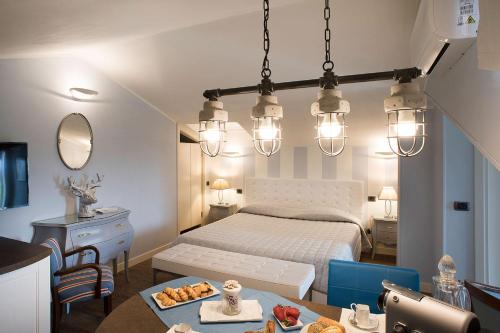 a bedroom with a bed and a table with food on it at AD MY HOME in Cortona