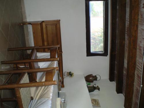 a room with two bunk beds and a window at Agriturismo Ternova in Alberese