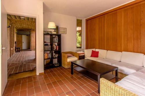a living room with a couch and a table at Catalunya Casas Rural charm on an olive farm in Costa Dorada! in Vespella de Gaià 