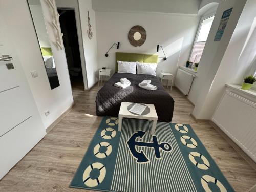 Ένα ή περισσότερα κρεβάτια σε δωμάτιο στο Apartamenty Via Mare