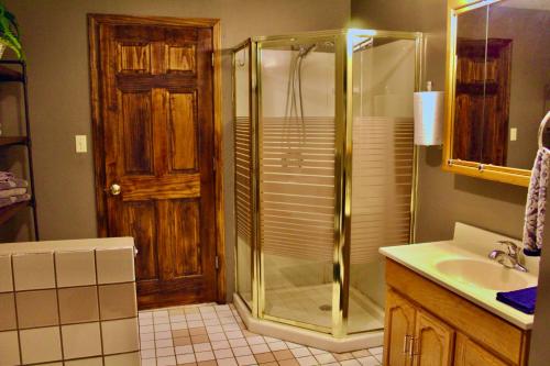 a bathroom with a shower and a sink at Browning Lambert Resort - Hatfield McCoy and Local Off-Road Trails in Rock