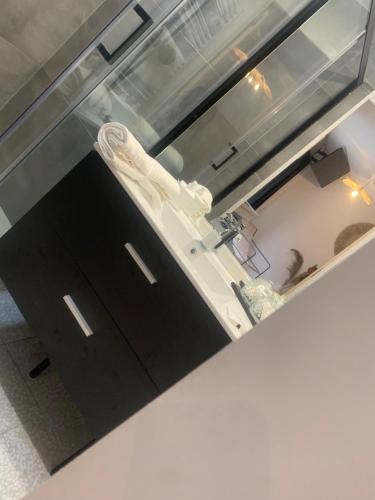 a kitchen with a sink and a counter top at les thermes du beffroi in Calais