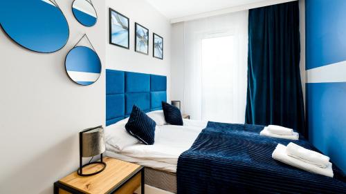 Apartamenty Sun & Snow Źródlana tesisinde bir odada yatak veya yataklar