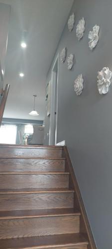 a staircase in a building with rocks on the wall at Jahsavvy's Nest in Hamilton