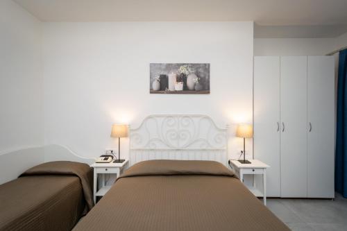 Postel nebo postele na pokoji v ubytování Hotel Anna