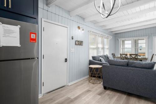 a living room with a couch and a table at Anchor Haven Ocean Views in Oak Island