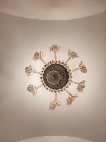 a chandelier hanging from a ceiling in a room at ROSSINI GUEST HOUSE in Martina Franca